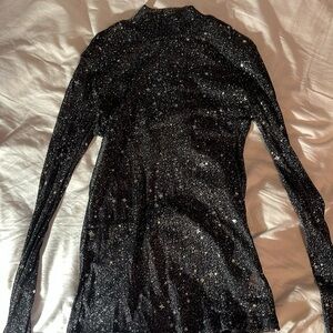 Black sparkly starry long sleeve. Size medium.